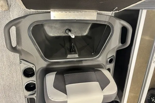 Slide: The Image of 2026 Sun Tracker Bass Buggy 18 DLX boat interior with seat and storage compartment. - 12