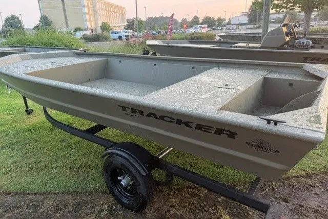 The Image of 2026 Tracker Grizzly 1648 Utility boat on trailer, parked outdoors. - 0