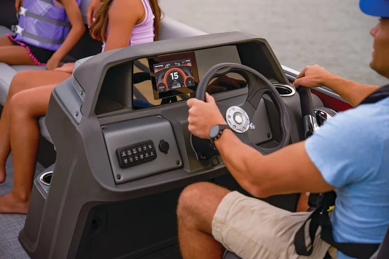 Slide: The Image of 2026 Sun Tracker Party Barge 18 DLX interior seating with cup holders. - 7