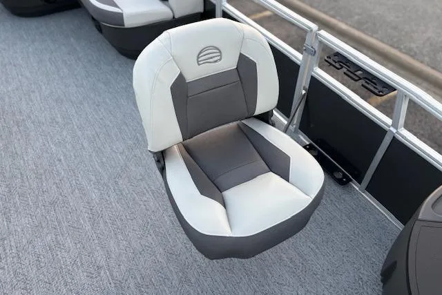 Slide: The Image of 2026 Sun Tracker Bass Buggy 18 DLX boat seat, gray and white upholstery, on deck. - 14