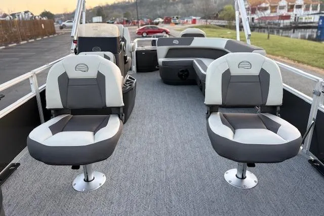 Slide: The Image of 2026 Sun Tracker Bass Buggy 18 DLX pontoon boat interior with comfortable seating. - 22