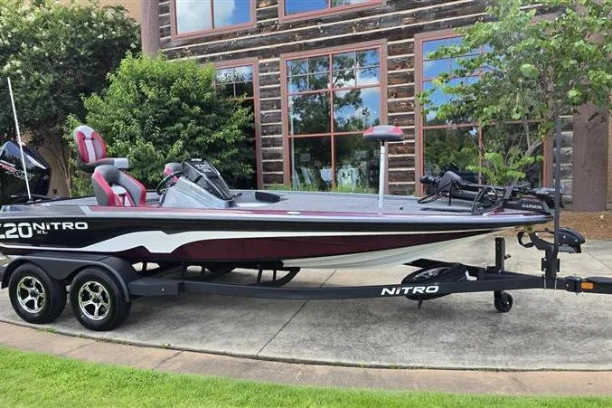 Slide: The Image of 2026 Nitro Z20 XL Pro boat on trailer, parked outdoors near a building. - 1