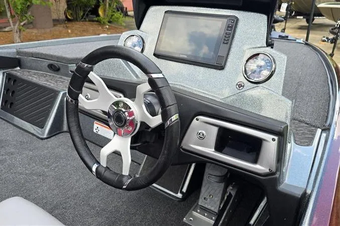 Slide: The Image of Interior of a 2026 Nitro Z20 XL Pro boat featuring a modern steering wheel and dashboard. - 12