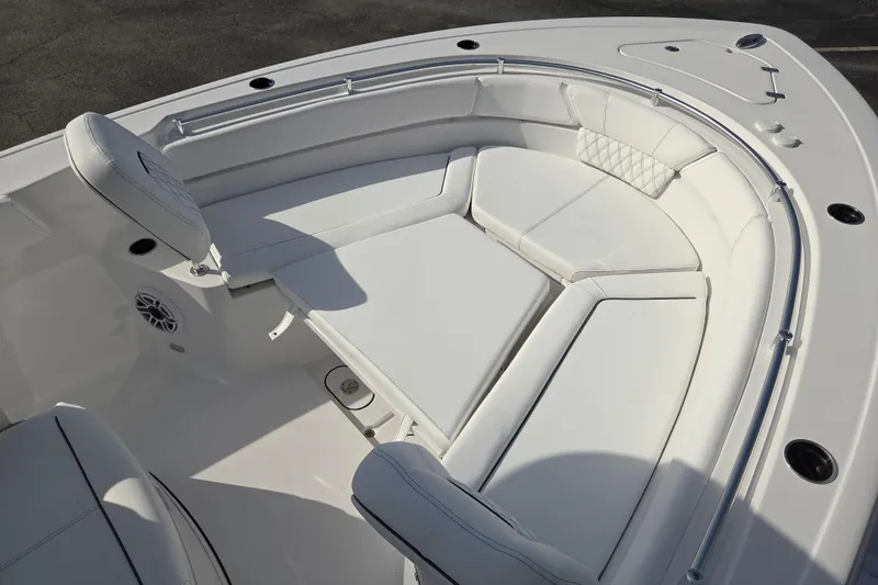 Slide: The Image of 2026 Sportsman Heritage 261 Center Console boat with luxurious white seating area. - 10