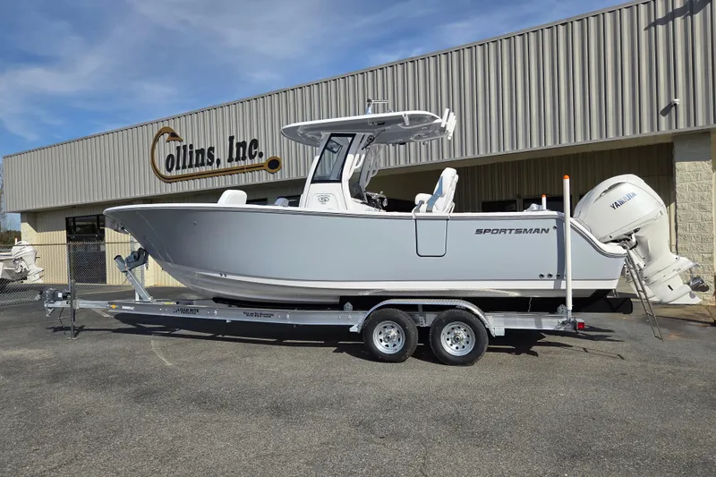 Slide: The Image of 2026 Sportsman Heritage 261 Center Console boat on trailer outside dealership. - 4