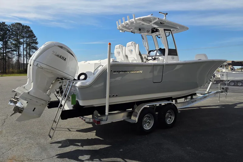 Slide: The Image of 2026 Sportsman Heritage 261 Center Console boat on trailer with Yamaha outboard motor. - 5