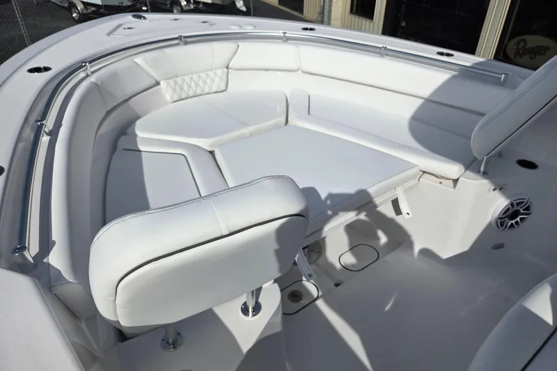 Slide: The Image of 2026 Sportsman Heritage 261 Center Console boat with white cushioned seating area. - 9