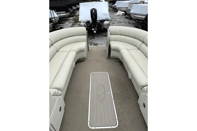 Slide: The Image of Interior of 2007 Harris Classic 240 I/O pontoon boat with beige seating. - 12