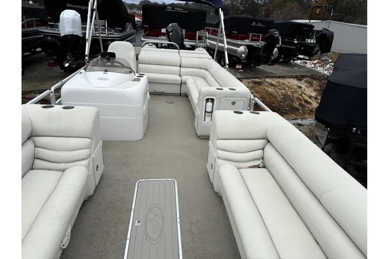 Slide: The Image of 2007 Harris Classic 240 I/O pontoon boat with spacious seating and modern design. - 3