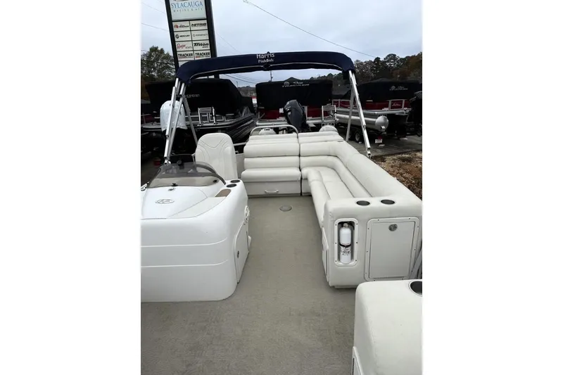 Slide: The Image of 2007 Harris Classic 240 I/O pontoon boat with spacious seating and canopy. - 5