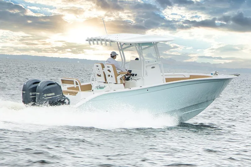 Slide: The Image of 2026 Cape Horn 24 OS boat cruising on open water at sunset. - 2