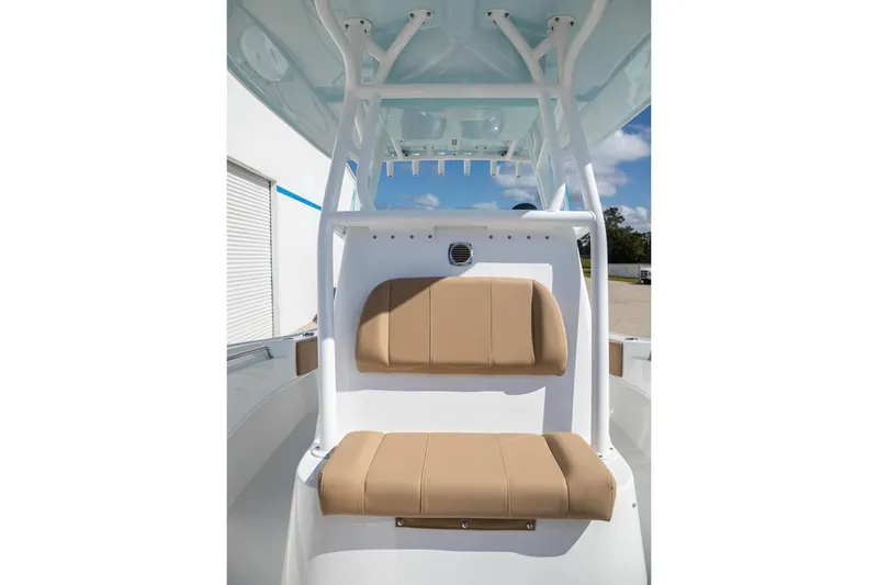 Slide: The Image of Manufacturer Provided Image: 2026 Cape Horn 24 OS boat interior with tan seating and white framework. - 8
