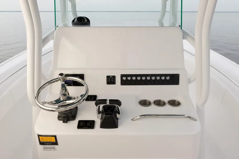 Slide: The Image of Manufacturer Provided Image: 2026 Cape Horn 24 OS boat console with steering wheel and controls. - 9