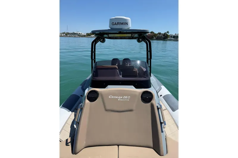 Slide: The Image of 2026 Ranieri Cayman Executive boat on water, featuring Garmin navigation system. - 15