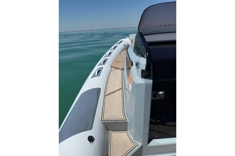 Slide: The Image of 2026 Ranieri Cayman Executive boat on calm water, showcasing sleek design and modern features. - 19