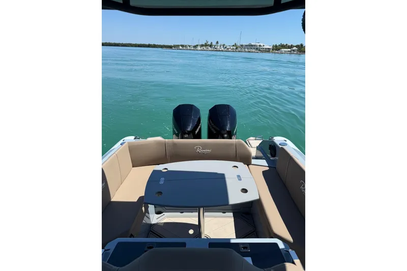 Slide: The Image of 2026 Ranieri Cayman Executive boat with dual engines on calm water. - 20