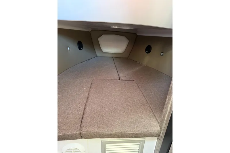 Slide: The Image of Interior cabin of 2026 Ranieri Cayman Executive boat, featuring cushioned seating and modern design. - 23