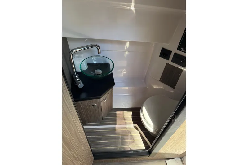 Slide: The Image of 2026 Ranieri Cayman Executive boat bathroom with modern sink and toilet. - 24