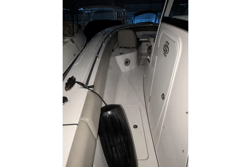 Slide: The Image of 2022 Sportsman Open 322 Center Console boat interior with seating and storage compartments. - 15