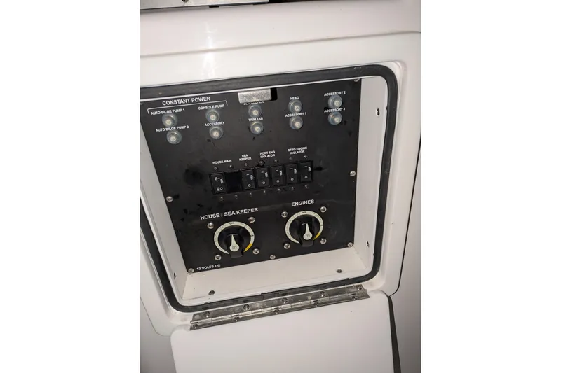 Slide: The Image of Control panel of a 2022 Sportsman Open 322 Center Console boat. - 16