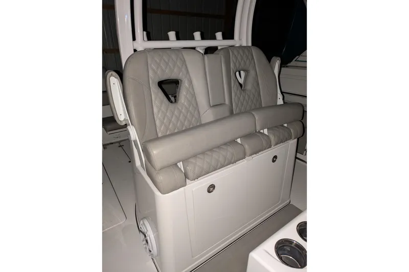 Slide: The Image of 2022 Sportsman Open 322 Center Console boat seats with diamond stitching. - 17