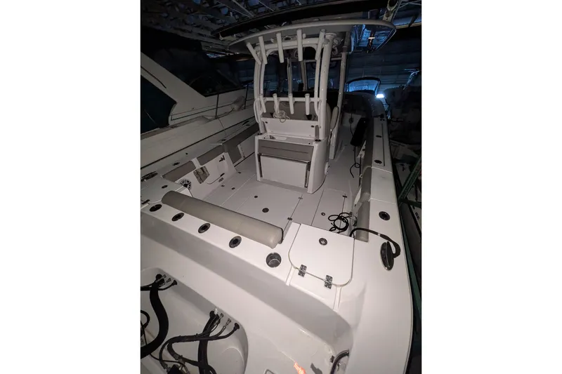 Slide: The Image of 2022 Sportsman Open 322 Center Console boat interior with spacious deck and seating. - 21
