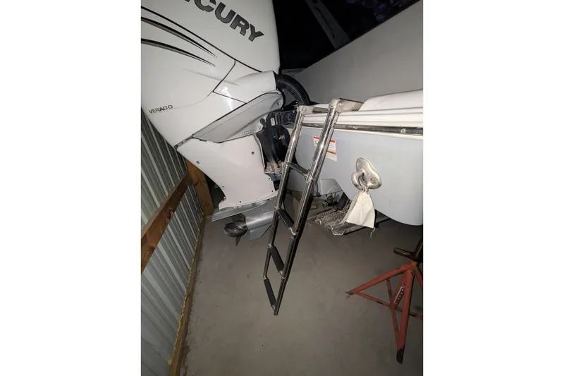 Slide: The Image of 2022 Sportsman Open 322 Center Console with Mercury Verado engine and ladder. - 22