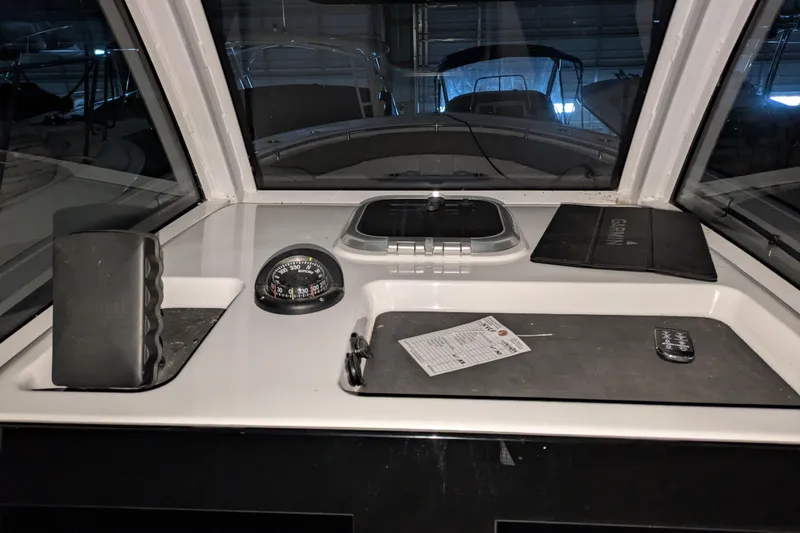 Slide: The Image of 2022 Sportsman Open 322 Center Console dashboard with compass and navigation equipment. - 8