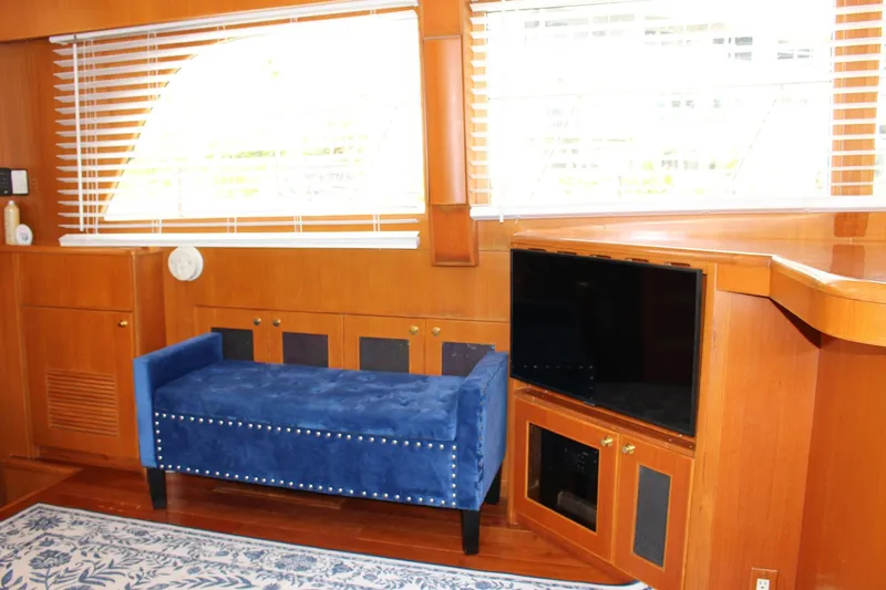Slide: The Image of Luxurious interior of 2007 Jefferson 45 Motor Yacht with blue velvet seating and TV. - 12
