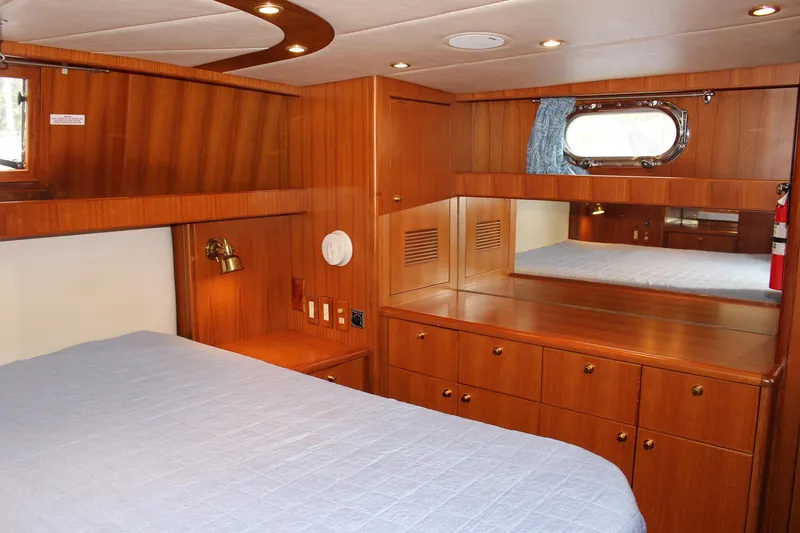 Slide: The Image of Luxurious wood-paneled cabin interior of a 2007 Jefferson 45 Motor Yacht. - 22