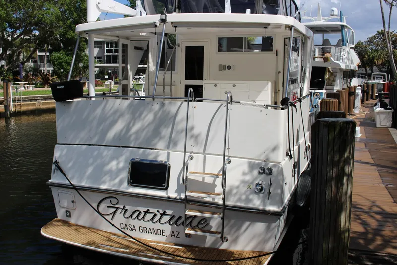 Slide: The Image of 2007 Jefferson 45 Motor Yacht docked, rear view with "Gratitude" name visible. - 29