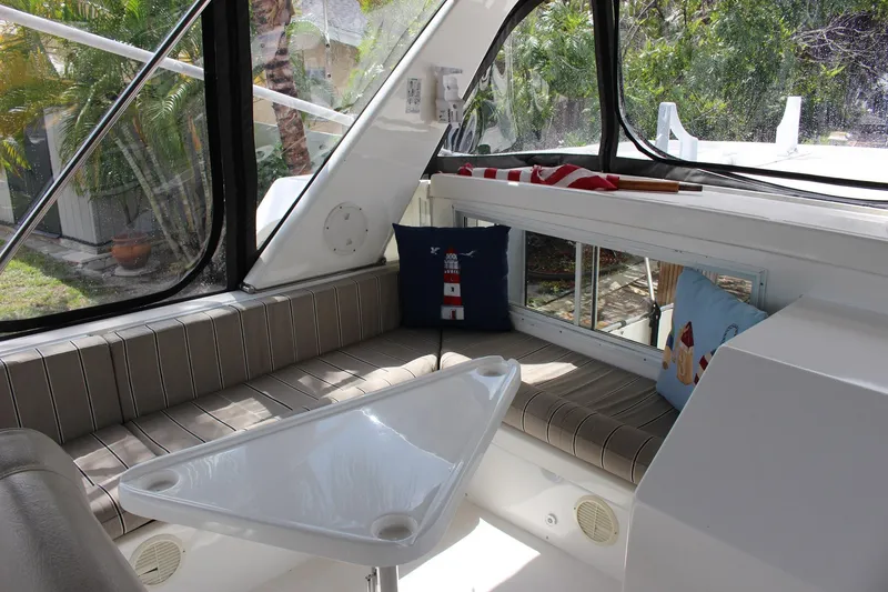 Slide: The Image of Interior of 2007 Jefferson 45 Motor Yacht with striped seating and nautical-themed pillows. - 7