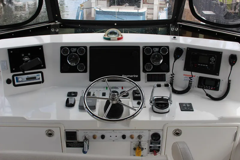 Slide: The Image of Cockpit of 2007 Jefferson 45 Motor Yacht with steering wheel and navigation controls. - 9