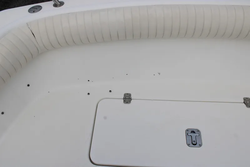 Slide: The Image of White boat interior with cushioned seating and storage hatch, Century 3100, year 2000. - 14