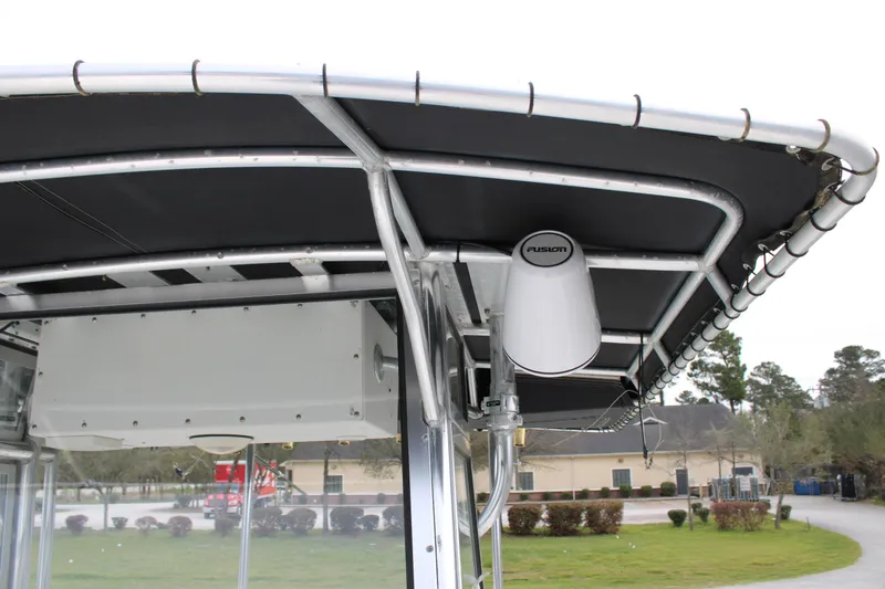 Slide: The Image of T-top of a 2000 Century 3100 boat with Fusion speaker installed. - 18