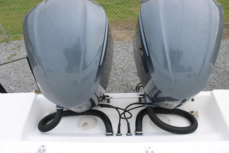 Slide: The Image of Twin outboard motors on a 2000 Century 3100 boat, viewed from above. - 22