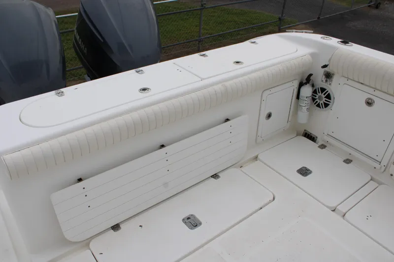 Slide: The Image of Century 3100 boat deck, 2000 model, featuring storage compartments and seating area. - 23