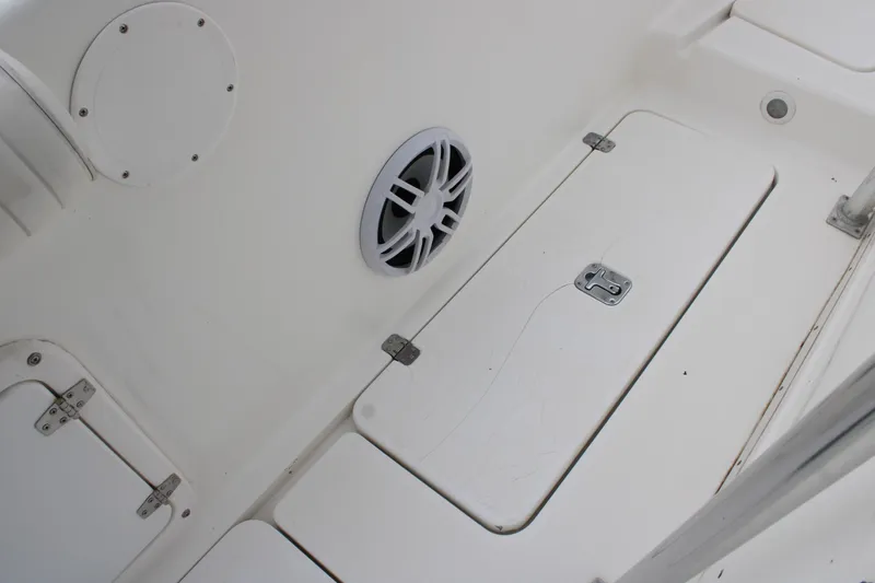 Slide: The Image of Interior of a 2000 Century 3100 boat showing storage compartments and speaker. - 31