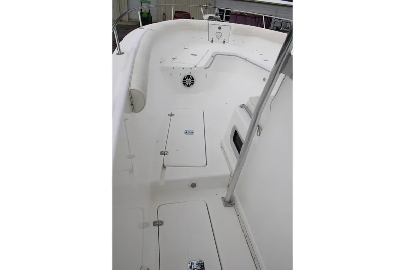 Slide: The Image of Century 3100 boat interior, 2000 model, featuring spacious white deck and seating area. - 32