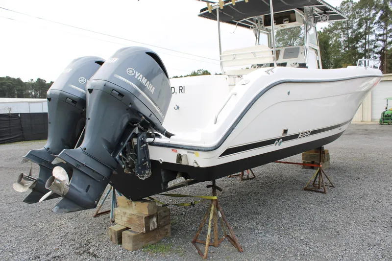 Slide: The Image of Century 3100 boat from 2000 with twin Yamaha outboard motors on stands. - 6