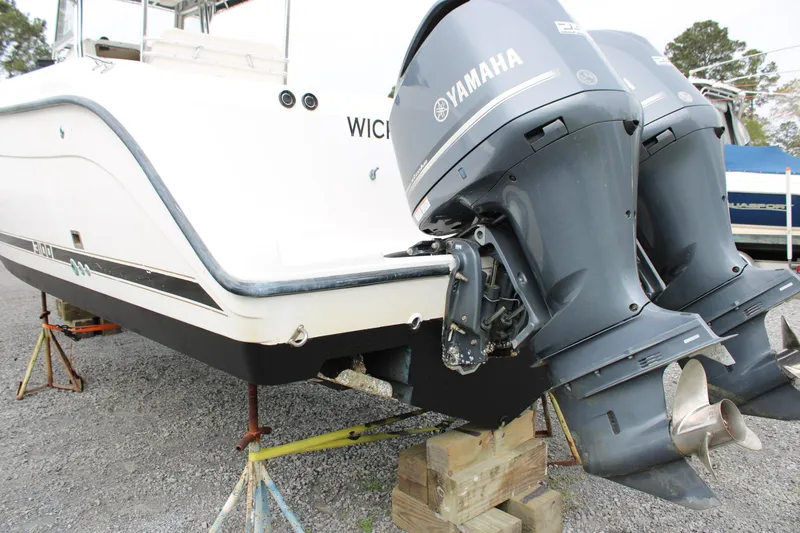 Slide: The Image of Century 3100 boat with Yamaha outboard motors on wooden blocks, year 2000 model. - 8