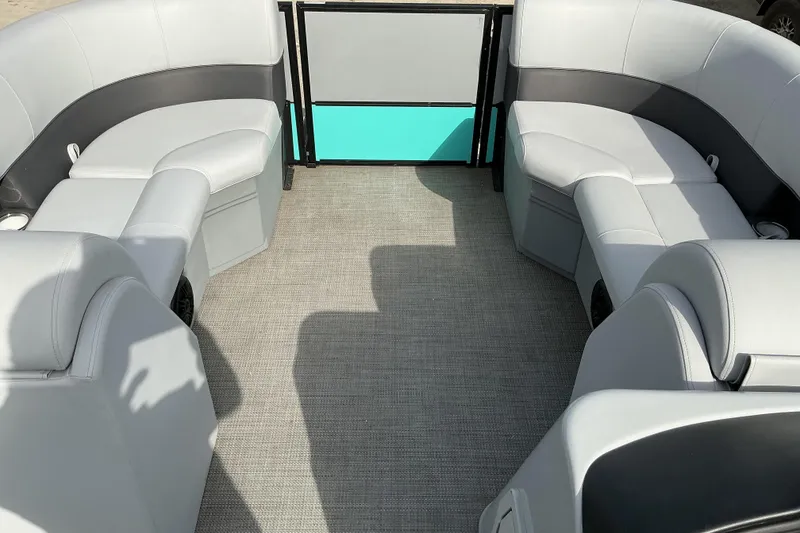 Slide: The Image of 2024 Bentley Pontoons 200 Navigator interior with gray seating and teal accents. - 9