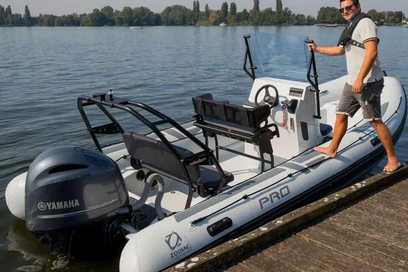 Slide: The Image of Manufacturer Provided Image: Man on Zodiac Pro 6.5 boat, Yamaha engine, 2026 model. - 2