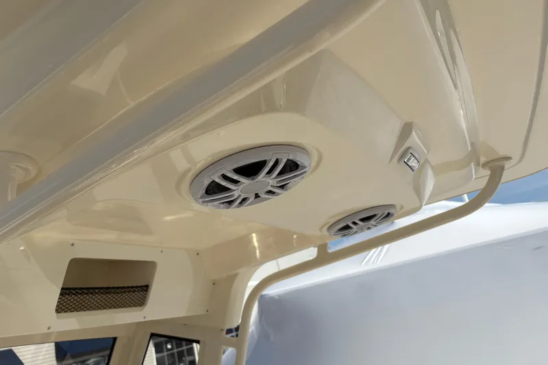 Slide: The Image of 2026 Scout 220 XSF boat interior with built-in speakers and storage compartment. - 11