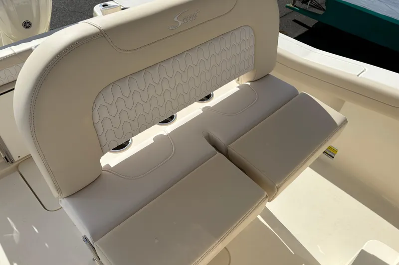 Slide: The Image of 2026 Scout 220 XSF boat seat with beige upholstery and stylish stitching. - 7