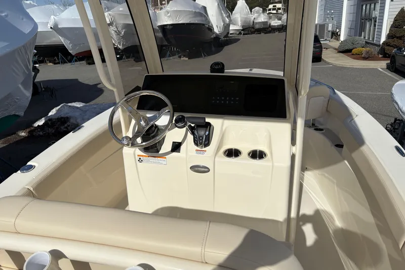 Slide: The Image of 2026 Scout 220 XSF boat cockpit with steering wheel and control panel. - 8