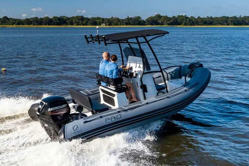 Slide: The Image of Manufacturer Provided Image: 2026 Zodiac Pro 5.5 boat cruising on a lake. - 0