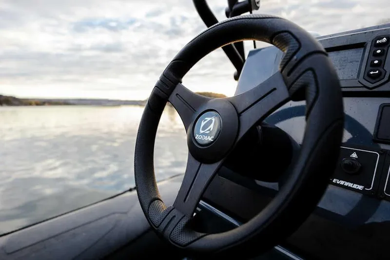 Slide: The Image of Manufacturer Provided Image: Zodiac Pro 5.5 2026 steering wheel overlooking calm waters. - 3