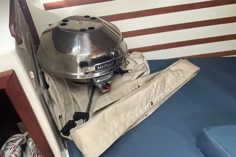 Slide: The Image of Stainless steel Magma grill on a 1987 Com-Pac 27 sailboat interior. - 23