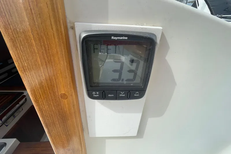 Slide: The Image of Raymarine depth gauge displaying 3.9 on a 1987 Com-Pac 27 sailboat. - 29